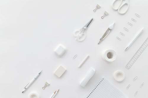 White Offiice Supplies on a White Surface 