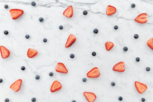 Free Top View Photo of Sliced Strawberries and Blueberries Stock Photo