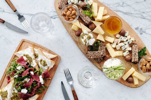 Free Photo Of Sliced Cheese On Wooden Surface Stock Photo