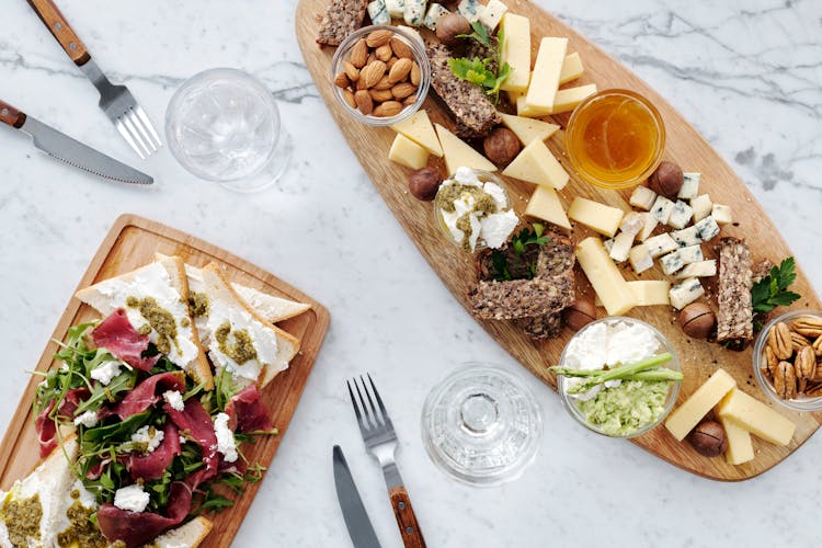 Photo Of Sliced Cheese On Wooden Surface