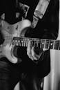 Grayscale Photo of Electric Guitar