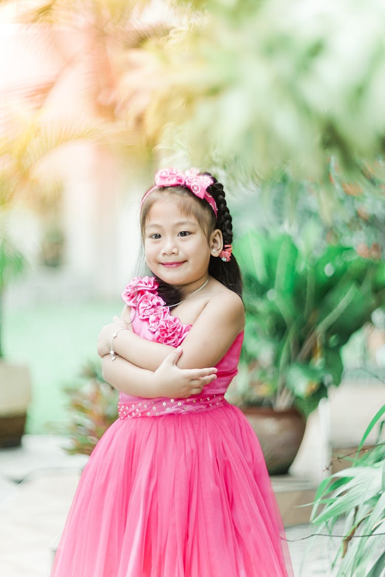 A Girl Wearing Pink Gown