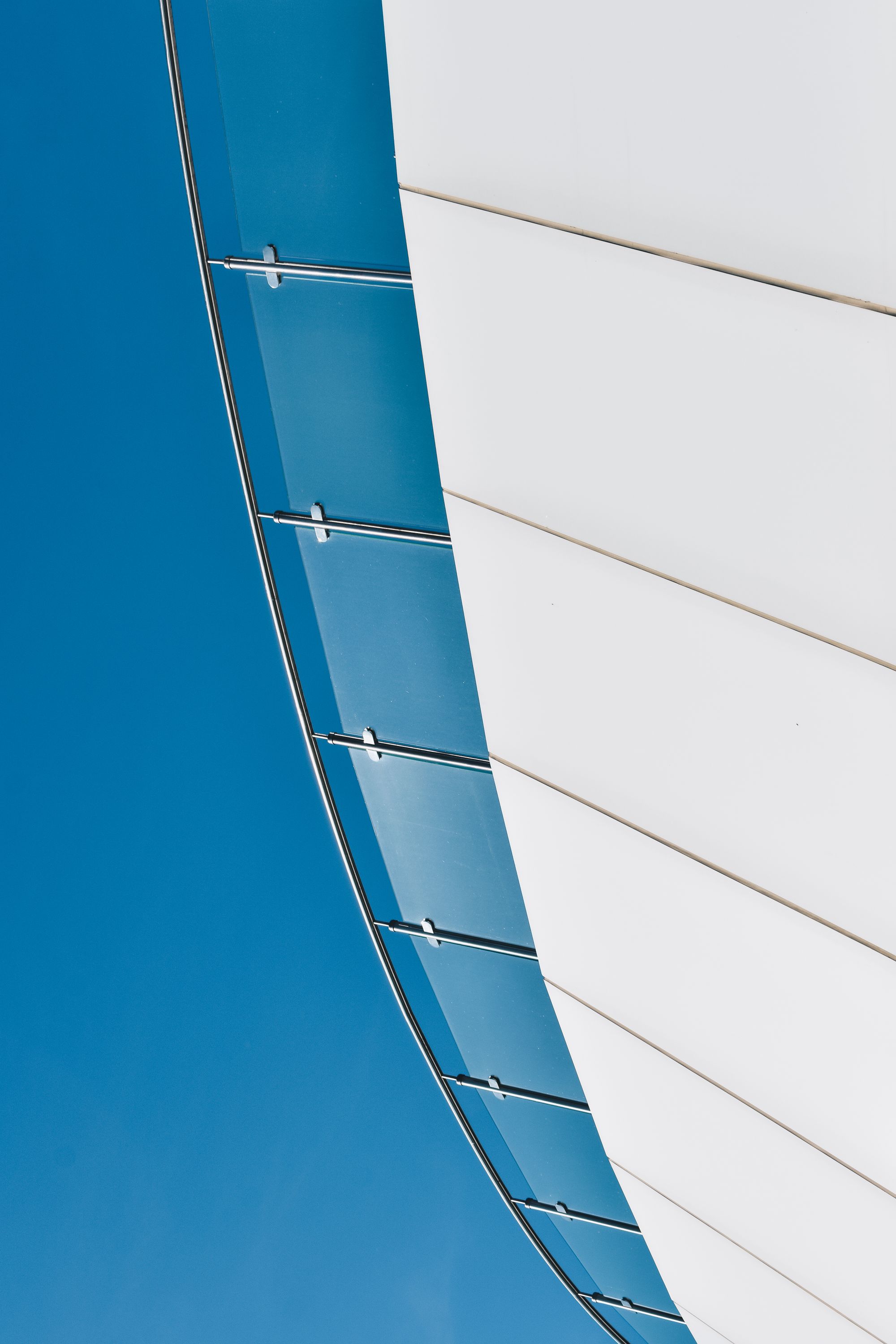 Futuristic glass panel architecture in calm minimal light