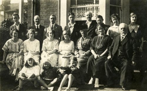Free A classic black and white family portrait depicting multiple generations sitting together. Stock Photo