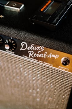 Detailed view of a Fender Deluxe Reverb Amplifier in a music studio setting.