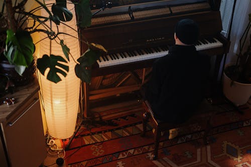 Free Man in Black Shirt Playing Piano Stock Photo