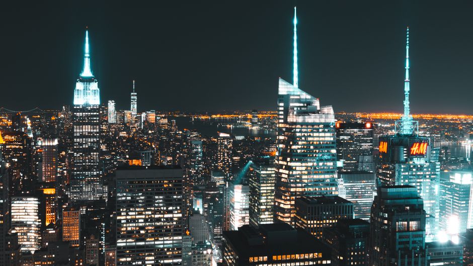 A breathtaking view of New York City's illuminated skyline featuring iconic skyscrapers. A breathtaking view of New York City's illuminated skyline featuring iconic skyscrapers.