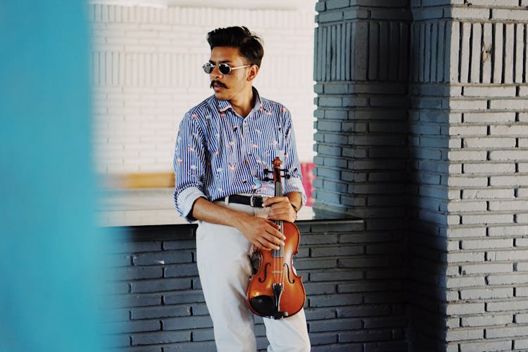 Stylish Indian Man With Violin In Modern Room