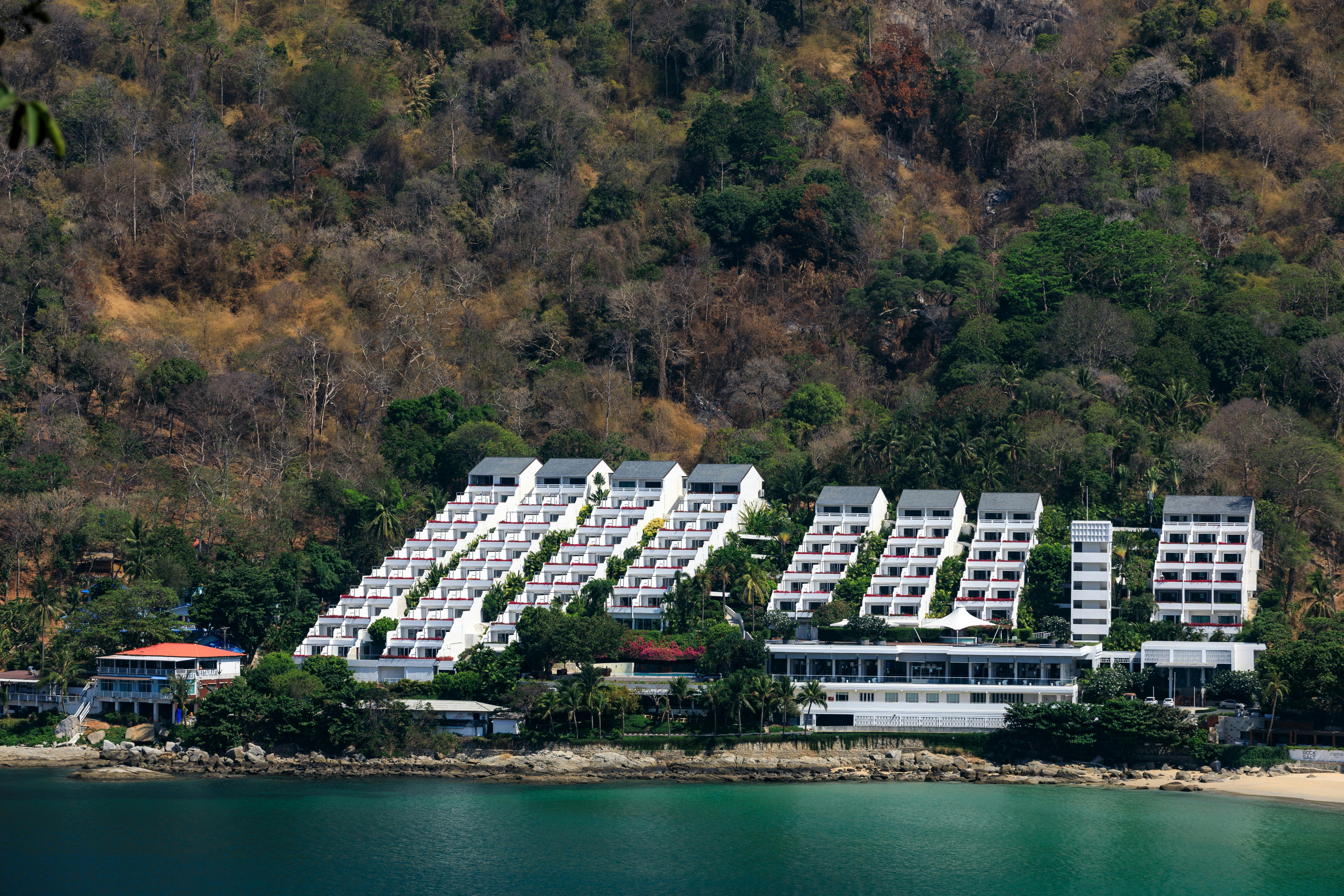 white concrete buildings near the ocean