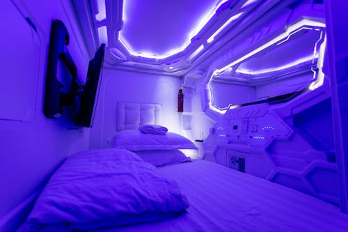 Interior of creative illuminated capsule hotel