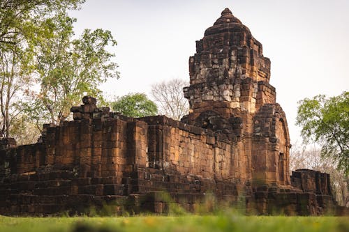 Free Bayon style Khmer temple in green historical park Stock Photo