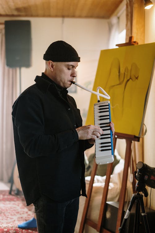 Man in Black Jacket Playing Piano