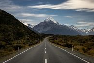 Road through hills and mountains covered with snow