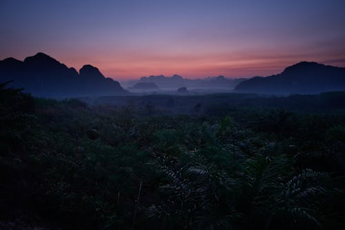 Silhouette of Mountains During Sunset