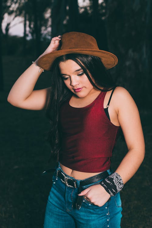 Beautiful Girl Wearing Hot Pants and Red Belly Top Stock Photo