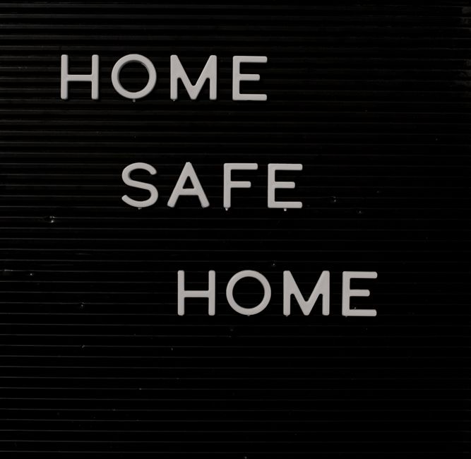Home Safe Home sign on a letter board reflecting safety and coziness.