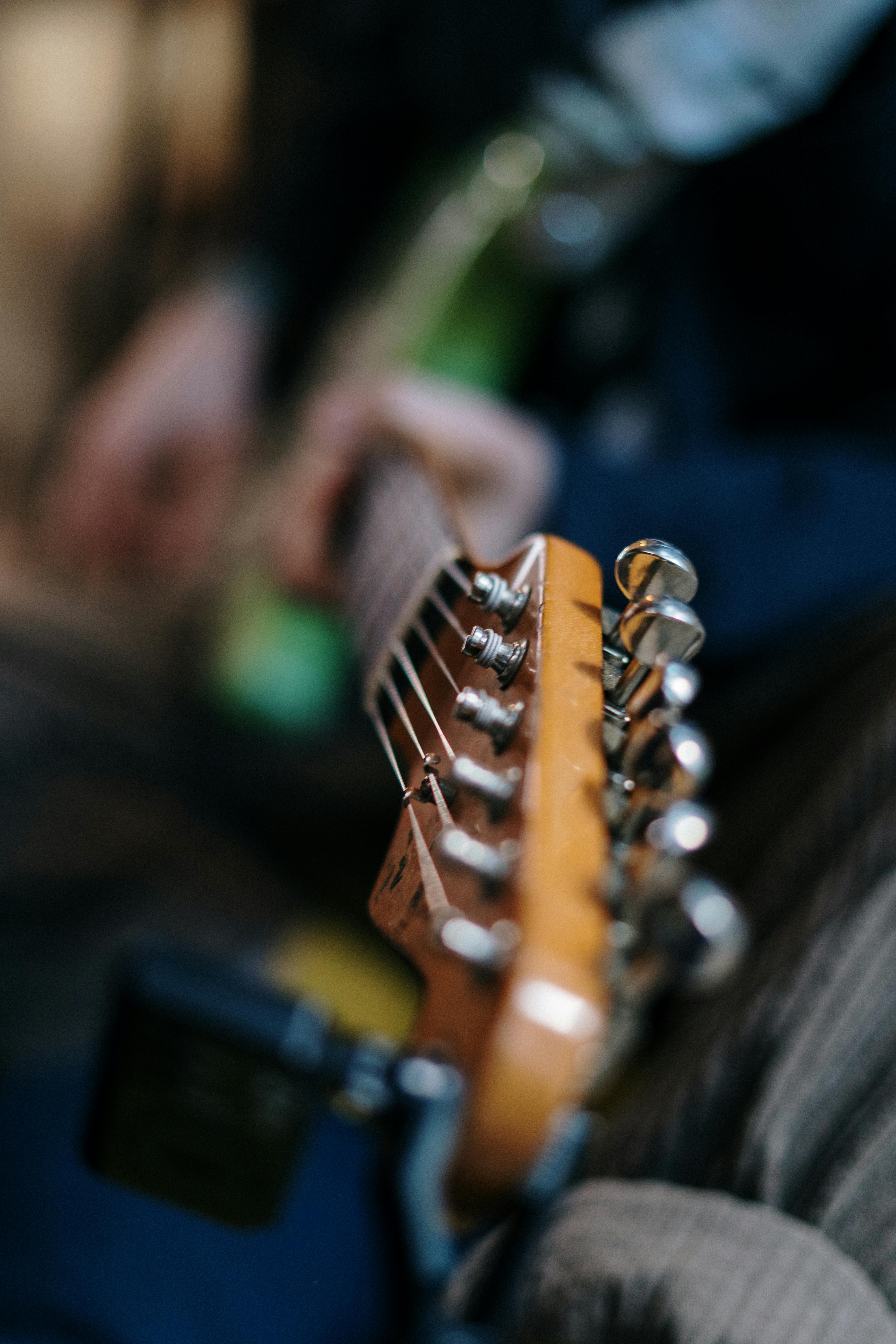 brown and black electric guitar