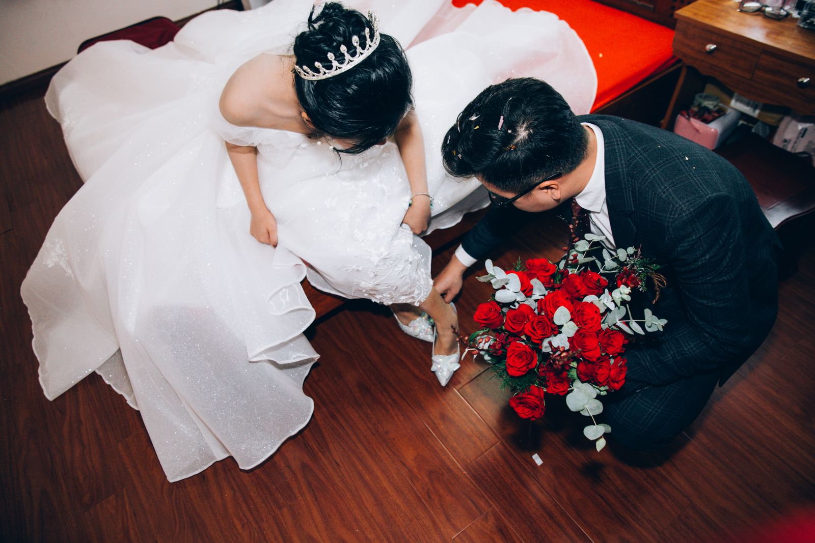 Bride and groom preparing for a wedding indoors