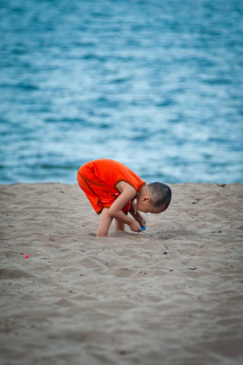 A Boy Playing on the Shore