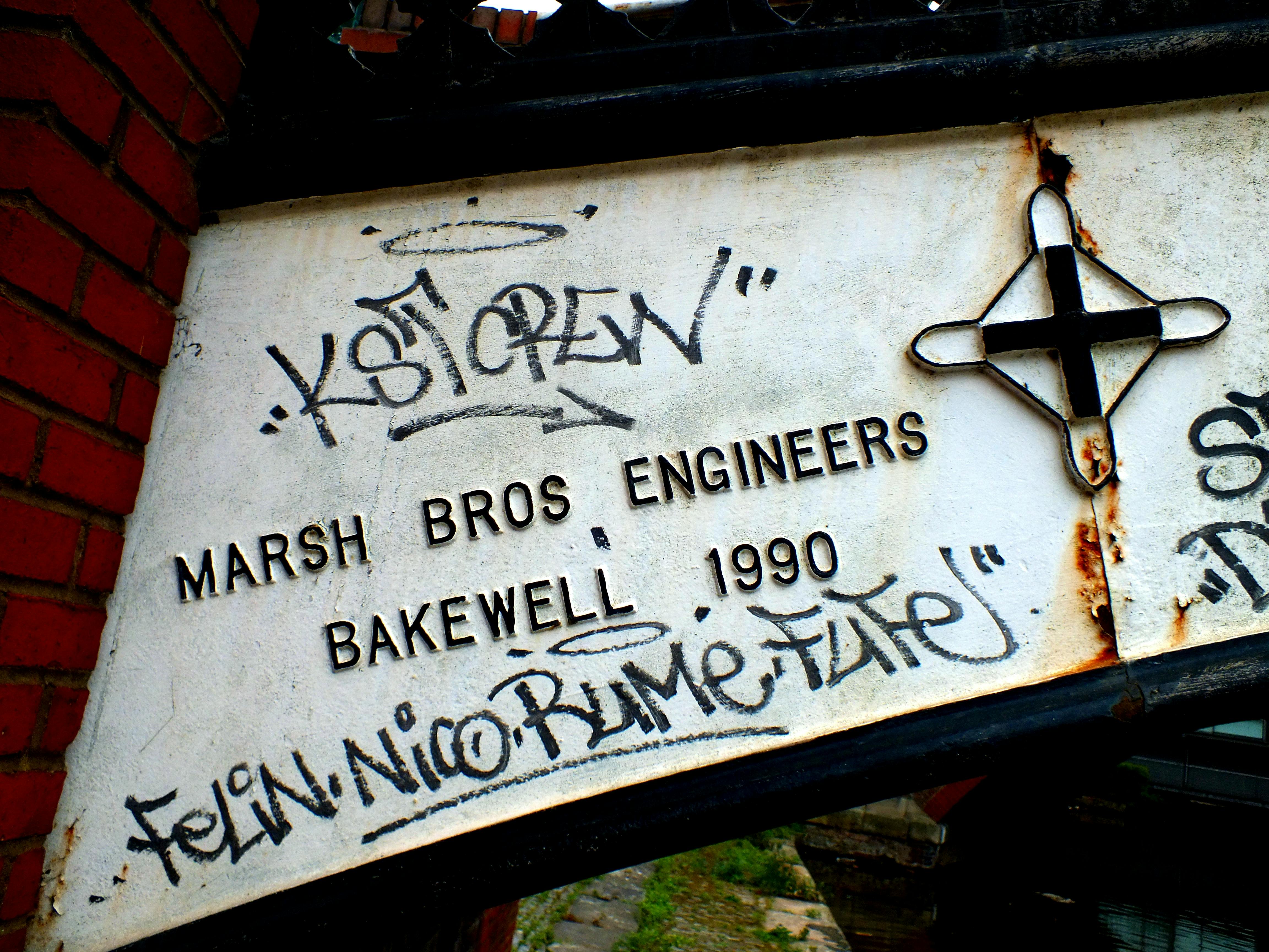 Golf irons of various lengths on a green