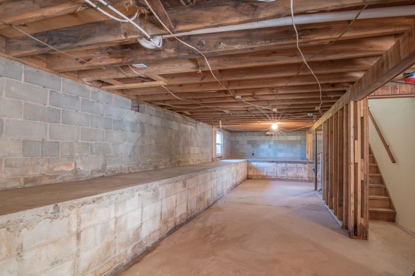 Unfinished basement with exposed framing