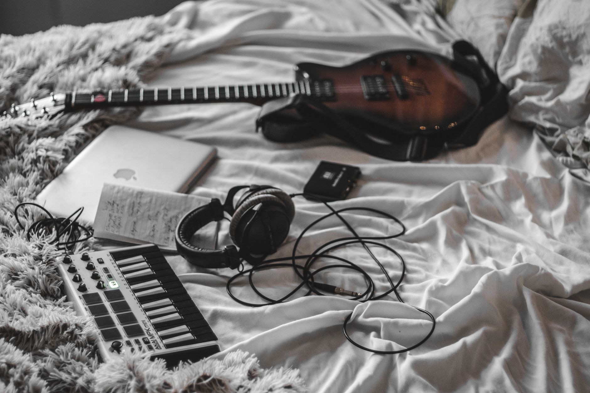 Melody Shape Notes Notebook and keyboard showing melody contour ideas for different song sections
