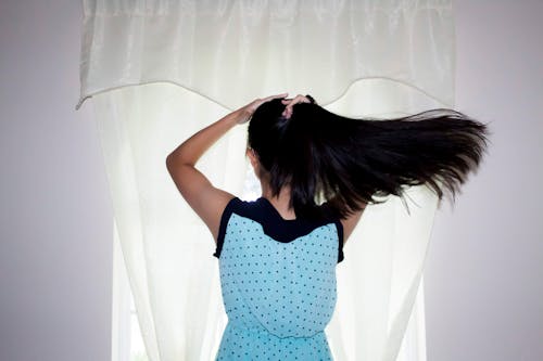 Free stock photo of back view, black hair, curtain Stock Photo