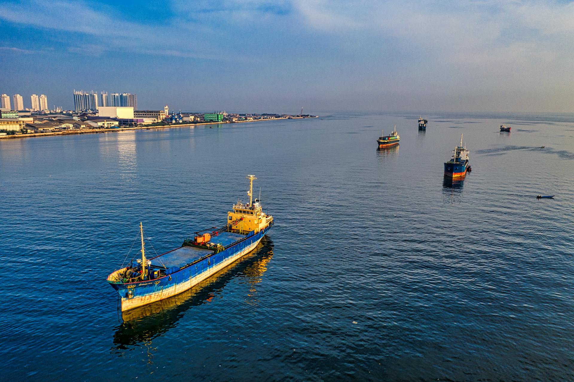 Aerial view of container ships in the ocean near Jakarta, Indonesia.