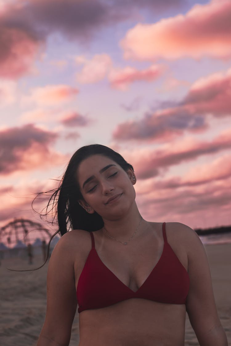 Teen Girl In Swimwear Sitting On Sandy Beach