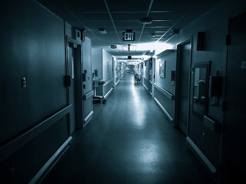 Empty long corridor of modern hospital