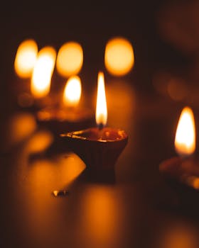 Oil lamps create a warm glow, symbolizing light over darkness in Indian festivities.