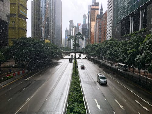 Cars Driving on a Slippery Asphalt Road