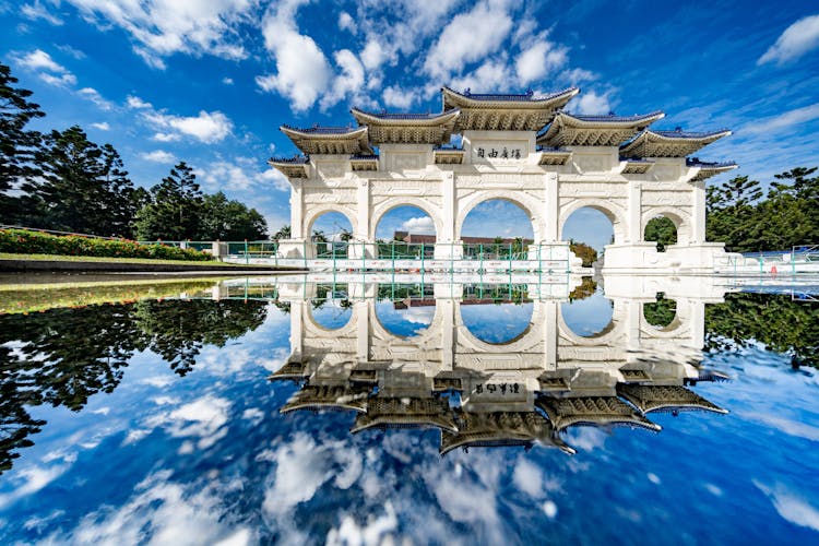 White Oriental Memorial Archway In Sunny Day