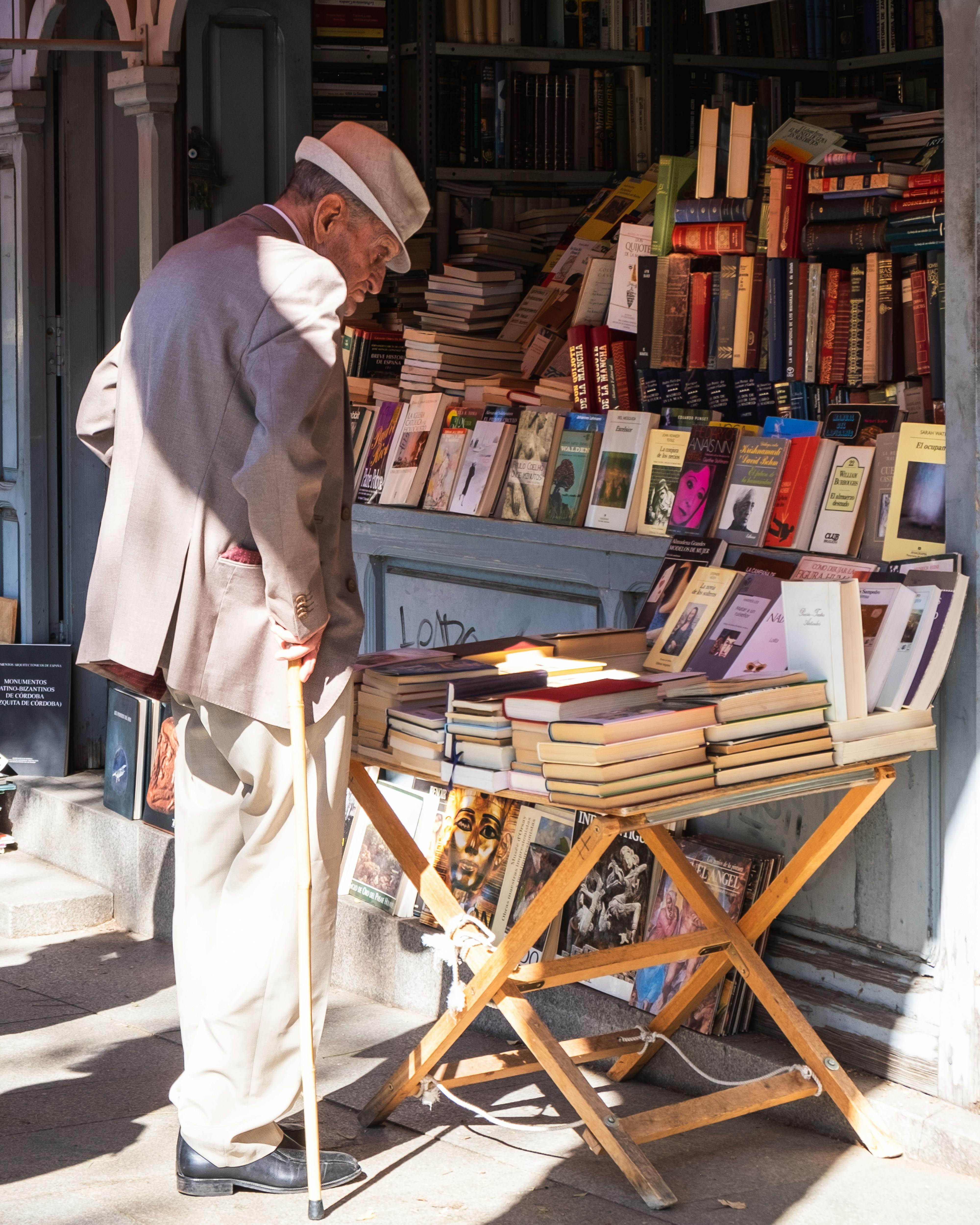 man looking for books