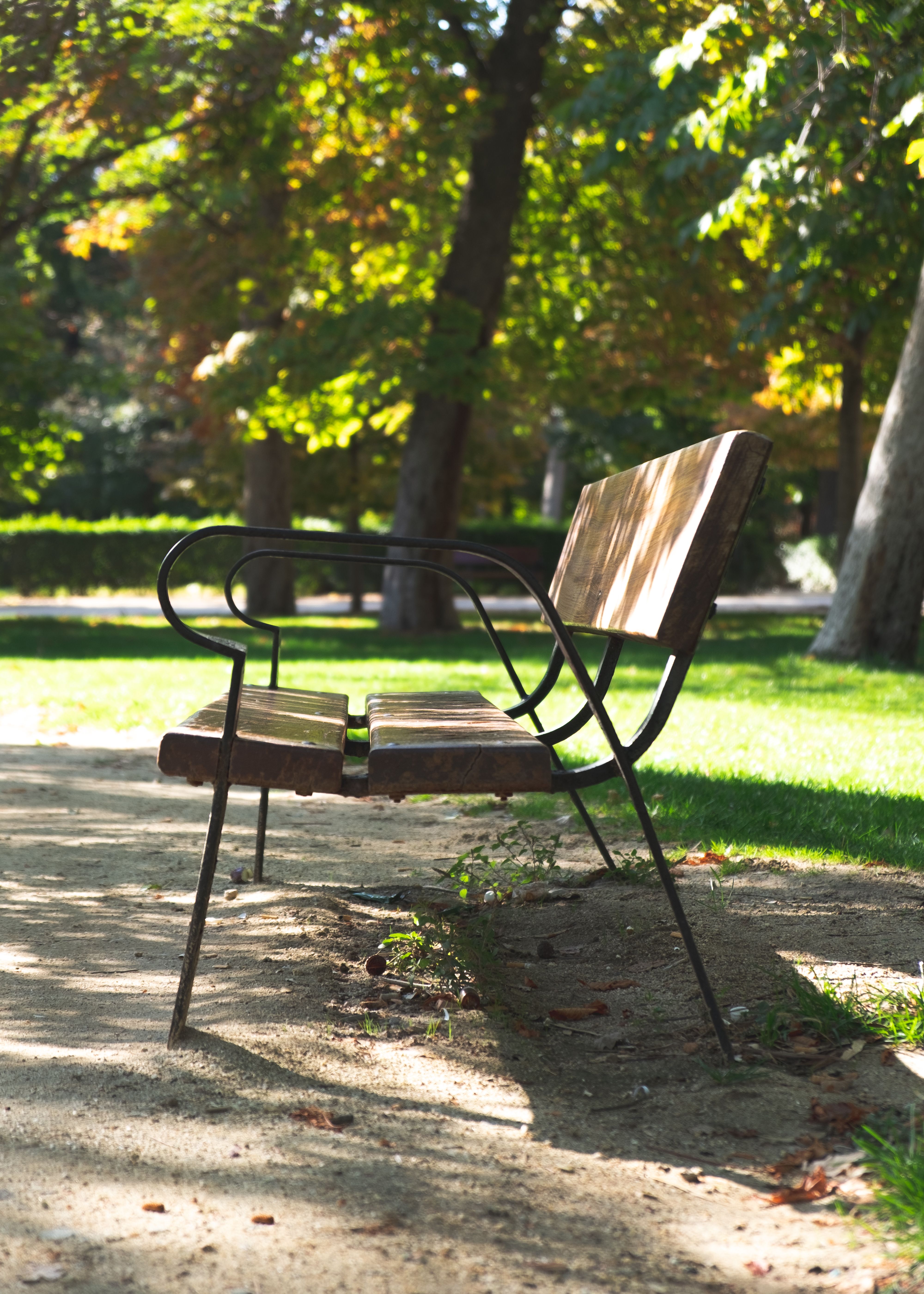 Brown Wooden Bench on Green Grass Field · Free Stock Photo