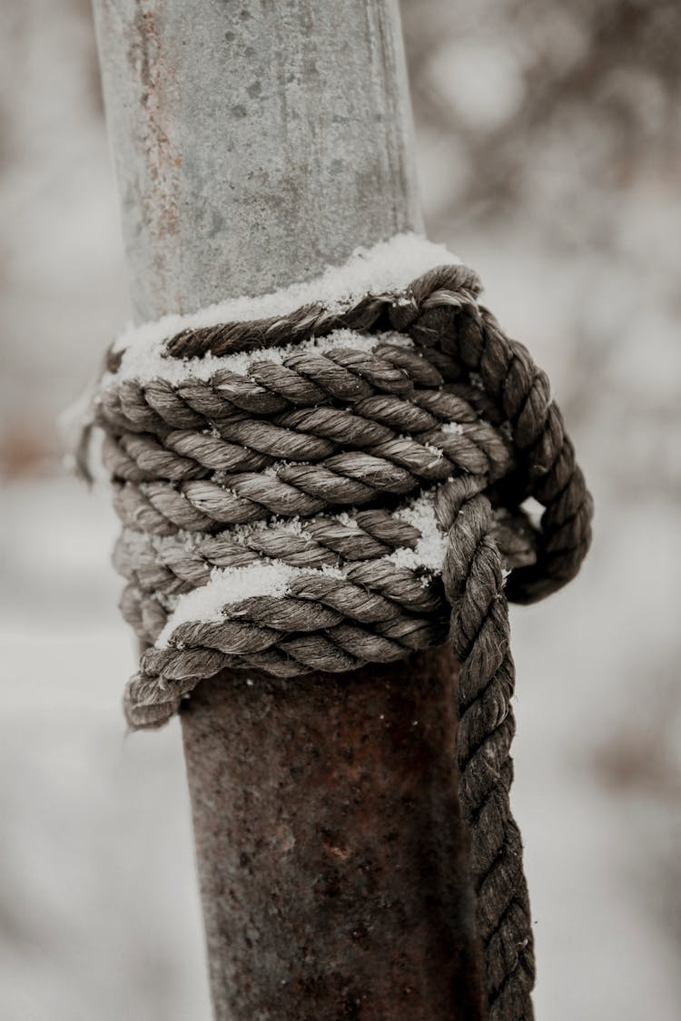 Gray Rope Tied On Rusty Post