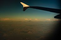 Airplane Wing over the Mountains