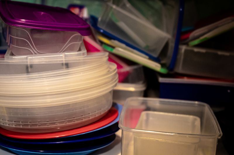 three stacked matching containers on a counter