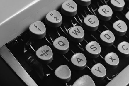Monospaced typewriter keys in monochrome — photo by Markus Winkler on Pexels