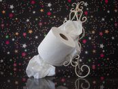 White Toilet Paper Roll on White and Black Textile