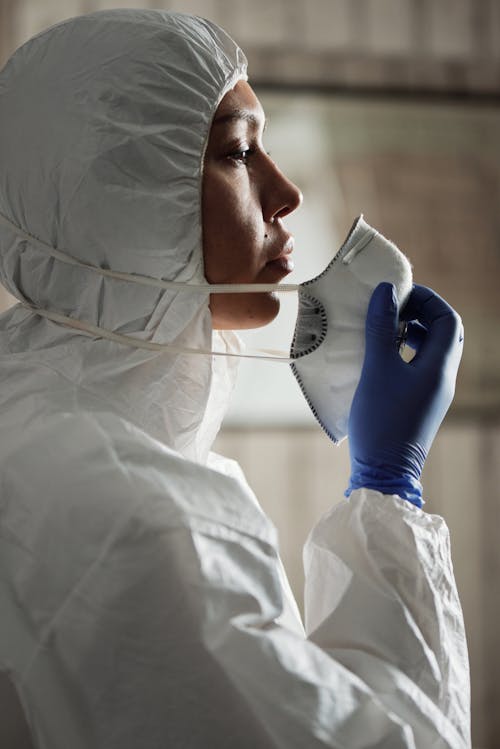 A Woman Wearing A Personal Protective Equipment