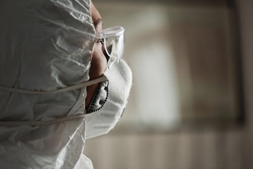 A Person Wearing Safety Glass and Face Mask