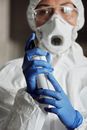 Person in White Hijab Holding Blue Bottle