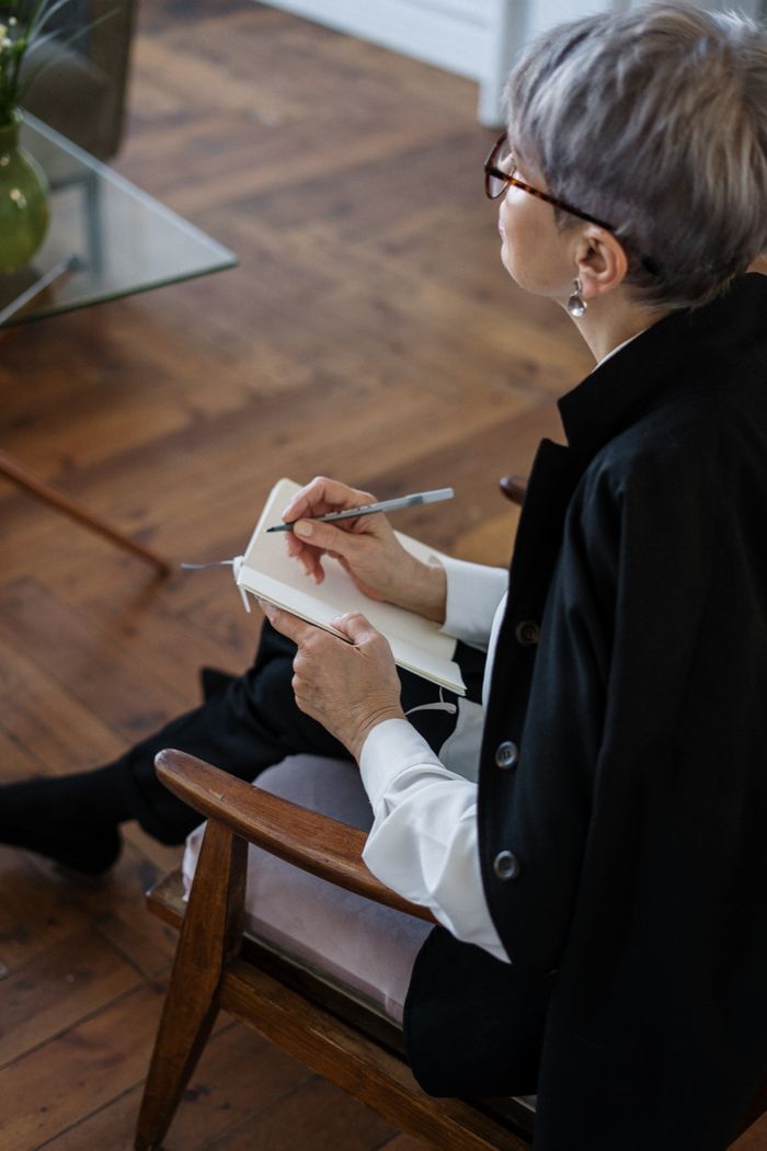 Two people sitting together at a kitchen table
