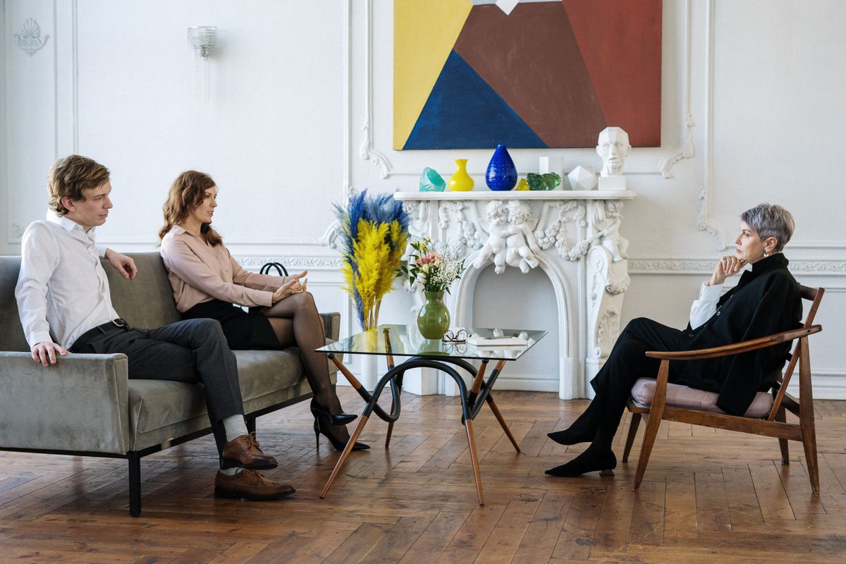 Partners reconnecting warmly during couples counseling