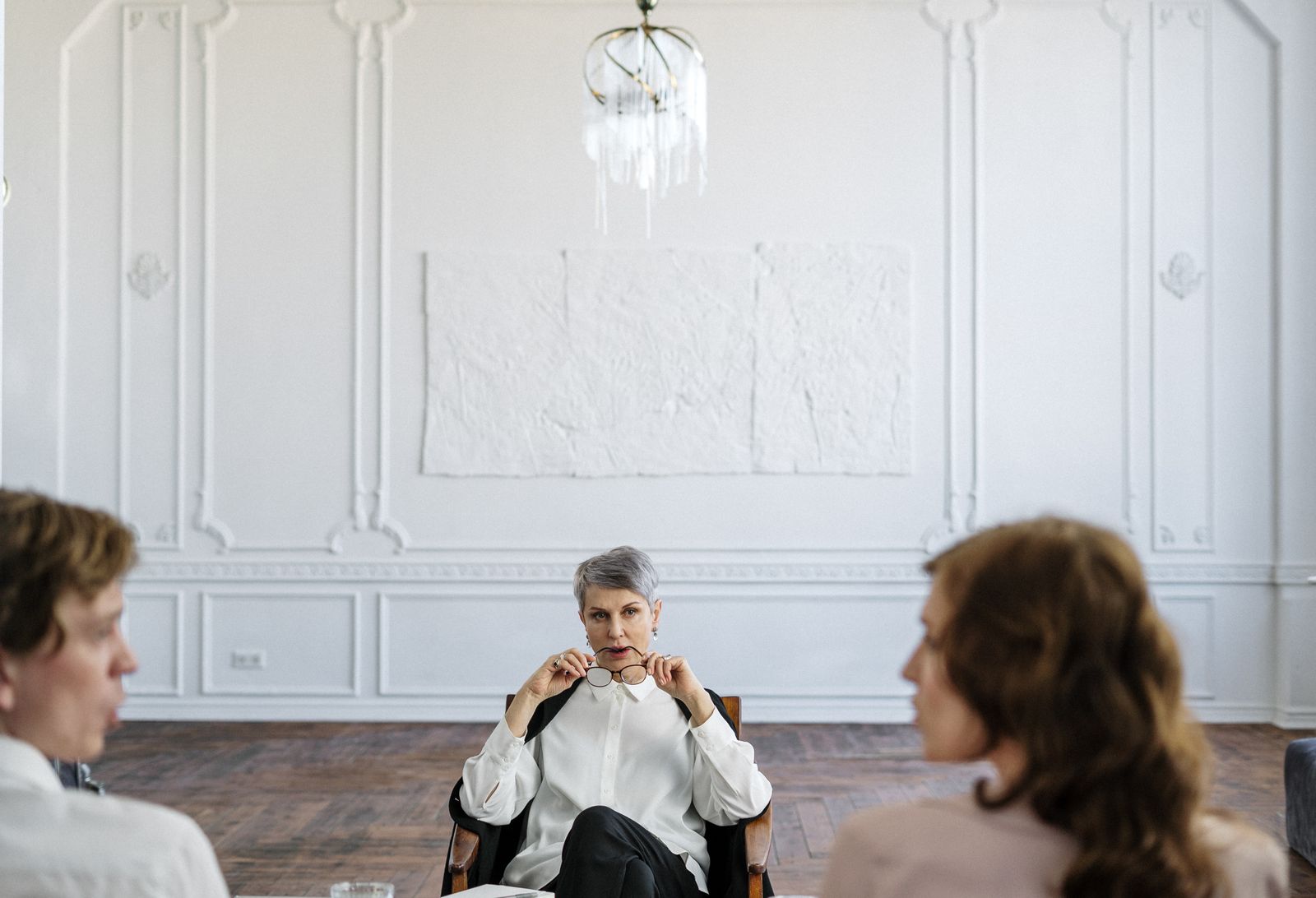 A couple talking through a difficult moment with their therapist