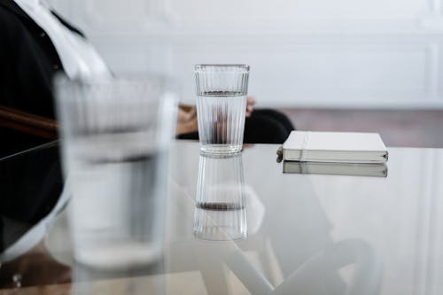 Clear Drinking Glass on Table
