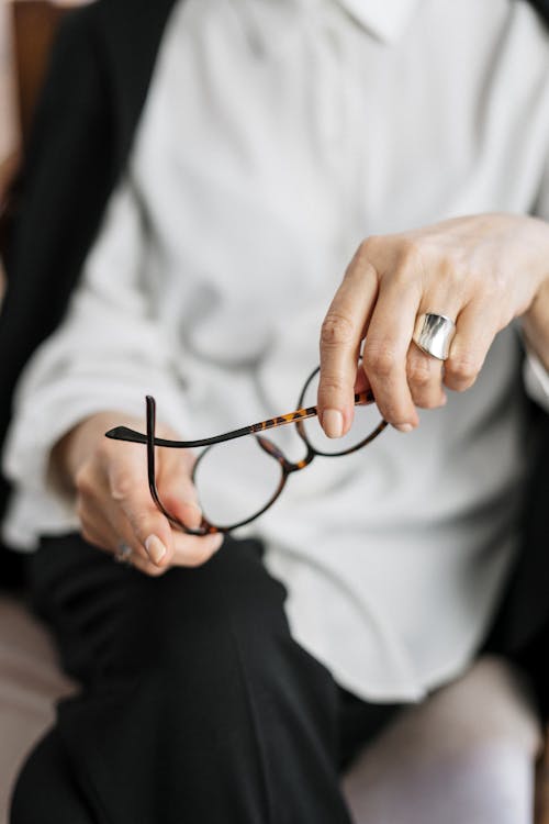 Free Person Holding Brown Framed Eyeglasses Stock Photo