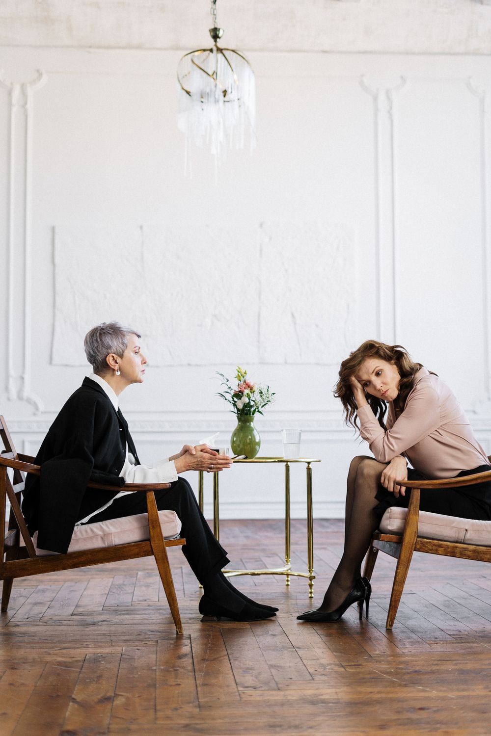 Two armchairs facing each other in the Heronsgate therapy room