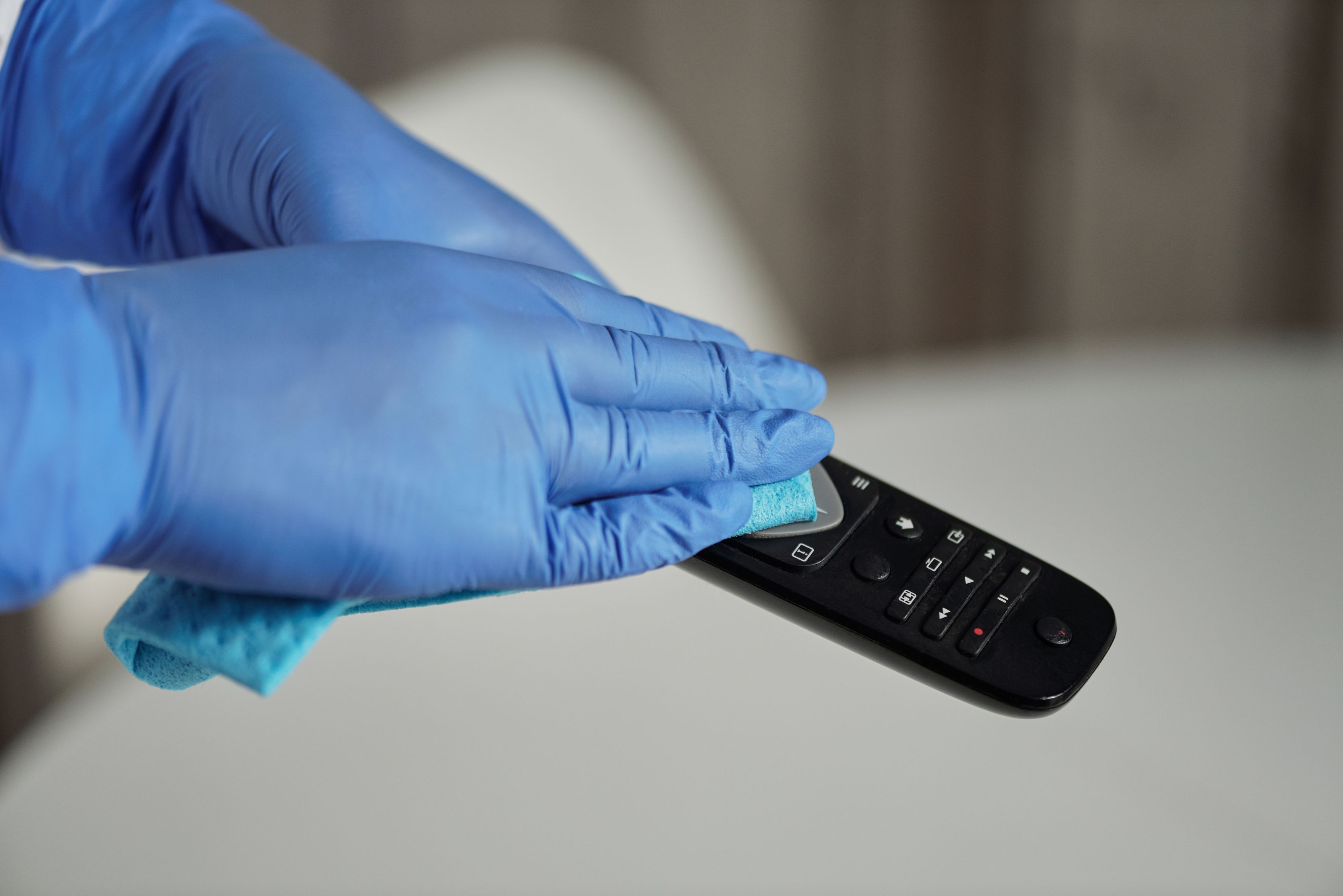 Person Holding Black Remote Control · Free Stock Photo
